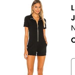 Lex Zipped Utility Romper in Jet Black from Revolve